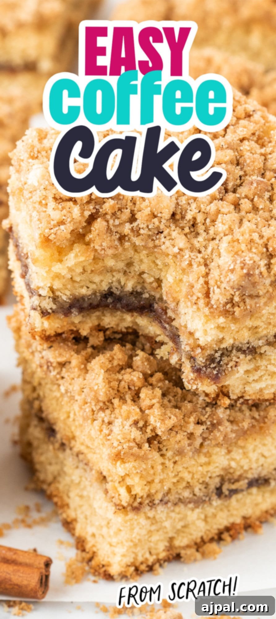 A stack of coffee cake slices on a table, highlighting the moist cake and crumbly streusel.