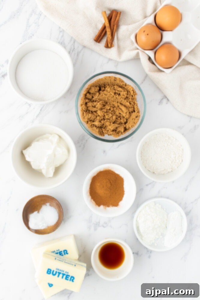 Collection of coffee cake ingredients like butter, sugar, eggs, and flour on a table