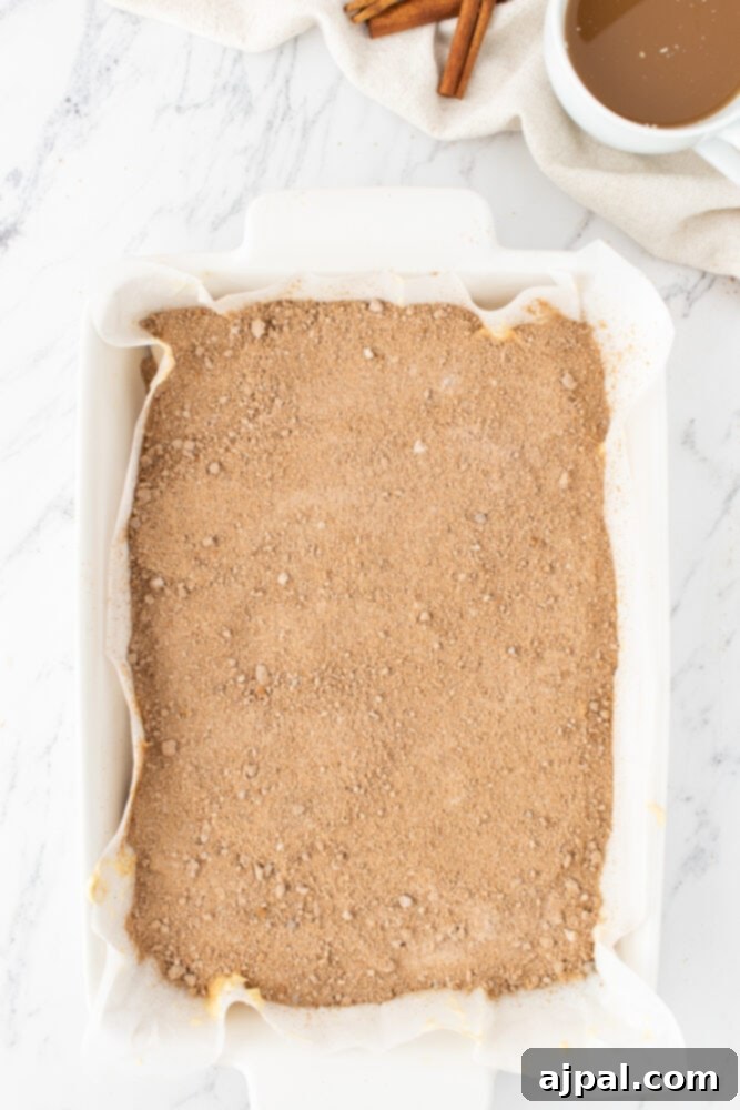 Coffee cake batter topped with cinnamon crumble before baking