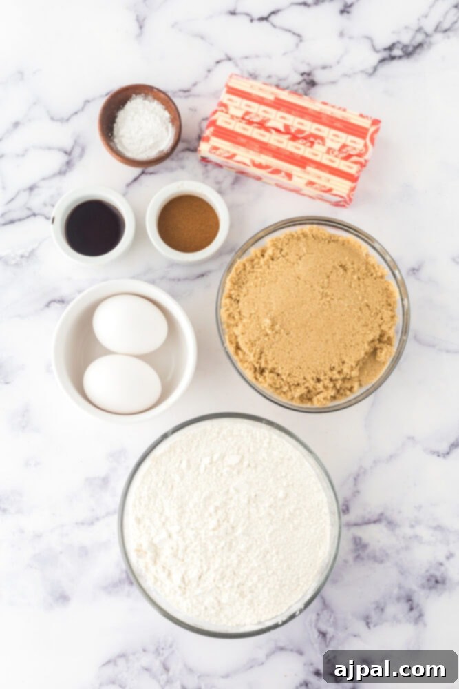 Ingredients for Snickerdoodle Blondies, including eggs, vanilla, brown sugar, flour, and butter, laid out on a table