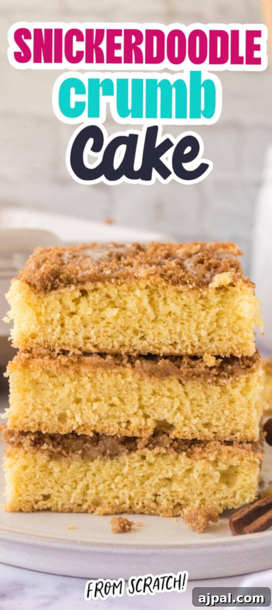 Snickerdoodle Streusel Cake 14 A stack of golden Snickerdoodle Crumb Cake slices on a white plate, ready to be served and enjoyed.