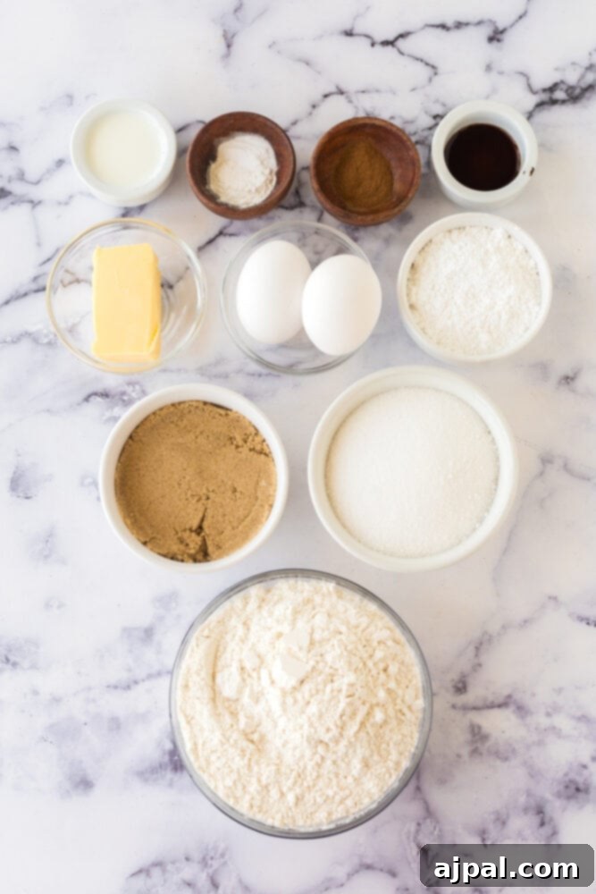 Snickerdoodle Streusel Cake 5 A collection of essential Snickerdoodle Crumb Cake ingredients, including eggs, sugar, flour, cinnamon, and butter, neatly arranged on a table, ready for baking.