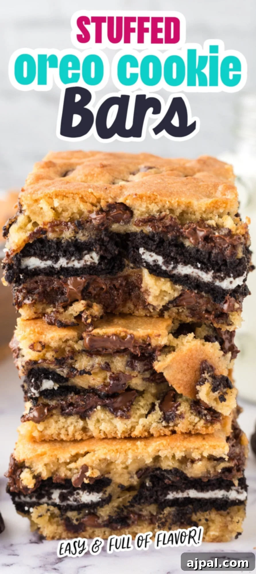 Decadent Oreo Bars 11 cookie bars stuffed with oreos stacked on top of each other on a table