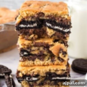 cookie bars baked with oreos stuffed in the middle stacked on top of each other on a table