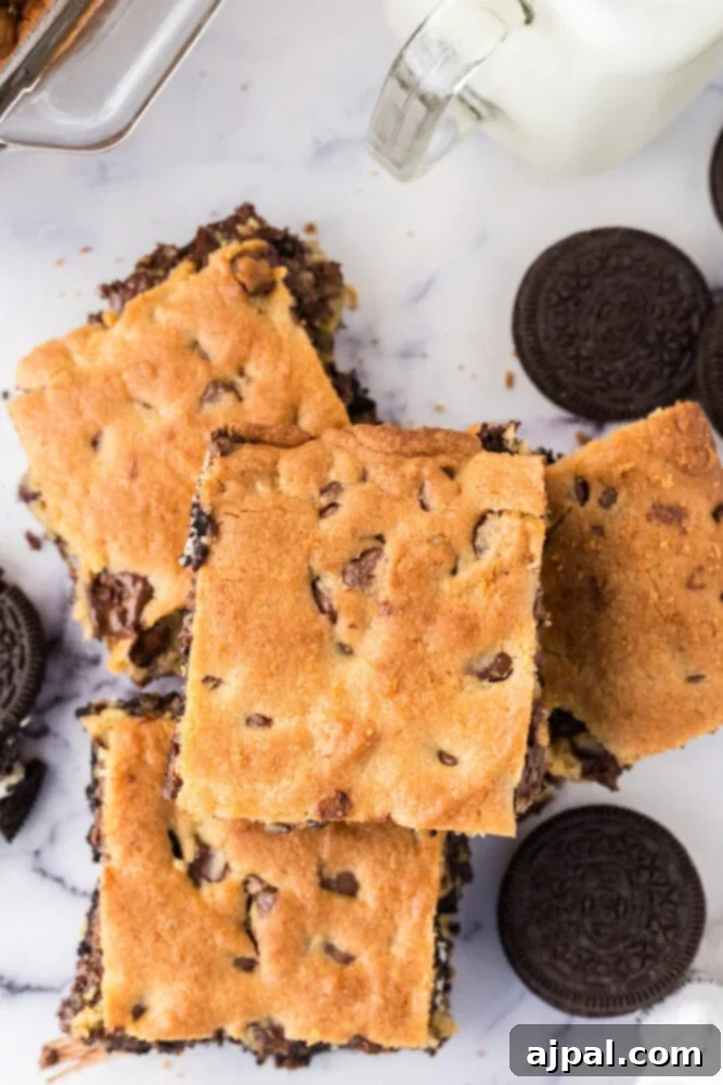 Decadent Oreo Bars 3 Easy oreo cookie bars stacked on top of each other.