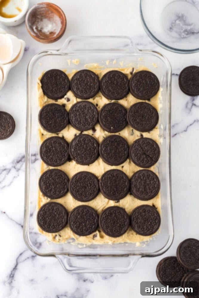 Decadent Oreo Bars 9 Cookie bars with oreos, baked in a glass dish.