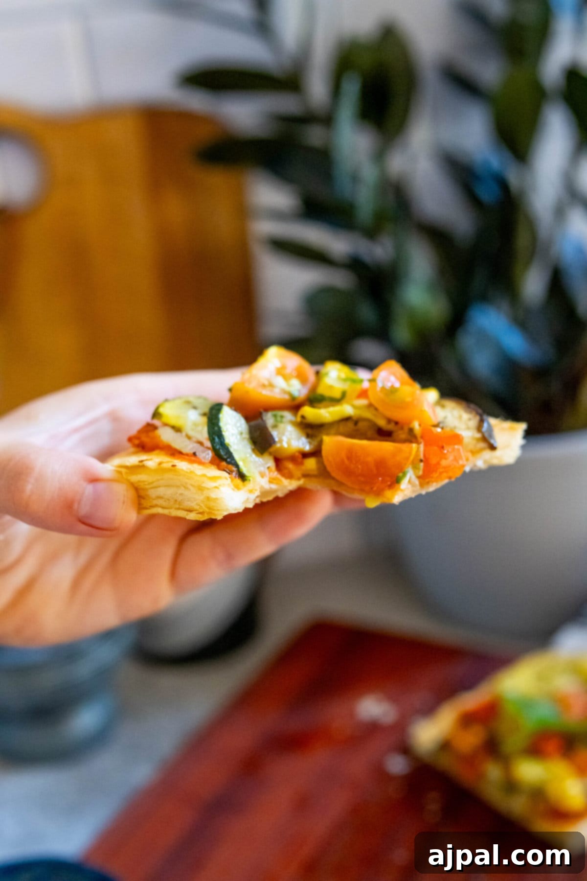 Ratatouille Tartlets 11 baked tarts with ratatouille in a hand