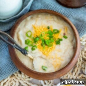potato soup with a spoon in it