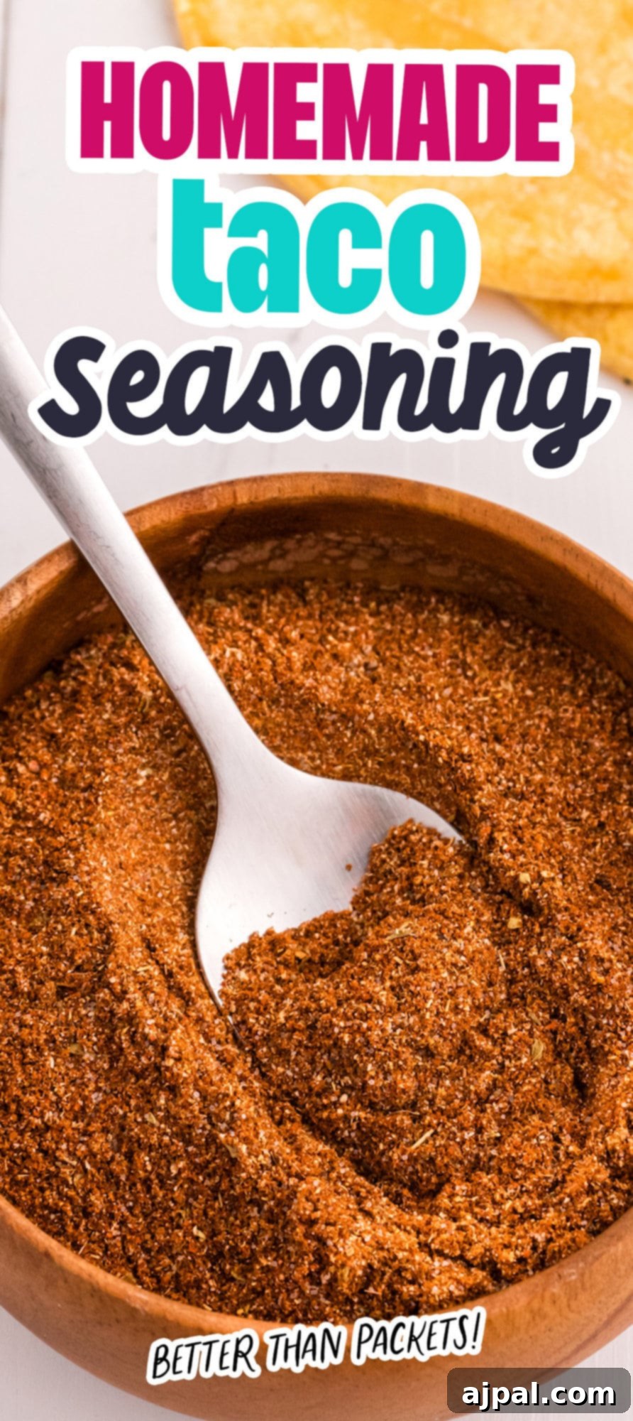 Taco Spice Blend 10 Homemade taco seasoning mix in a bowl with a wooden spoon, showcasing the rich blend of spices.