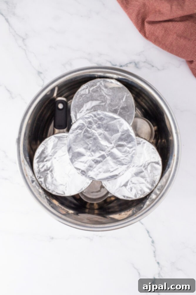 Your Instant Pot's Secret to Perfect Creme Brulee 11 ramekins covered in foil in an instant pot