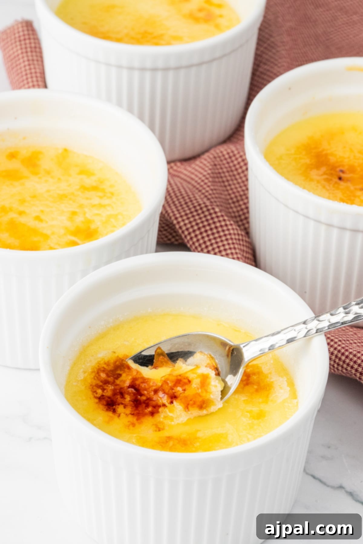 Your Instant Pot's Secret to Perfect Creme Brulee 16 Creme Brûlée in small white ramekins