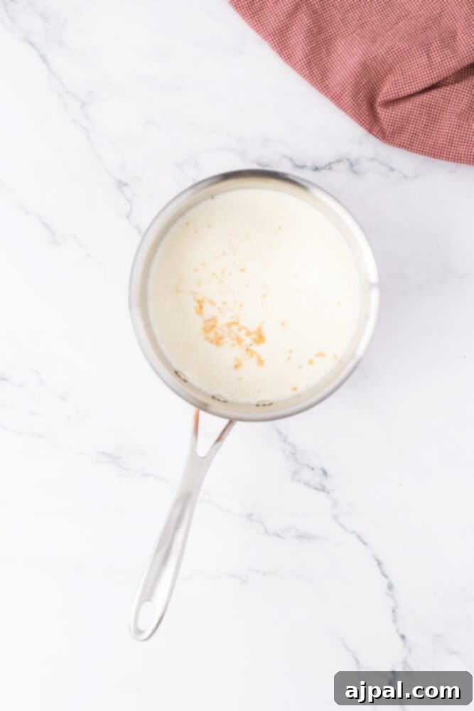 Your Instant Pot's Secret to Perfect Creme Brulee 7 a pot with egg yolk, milk, and sugar in it
