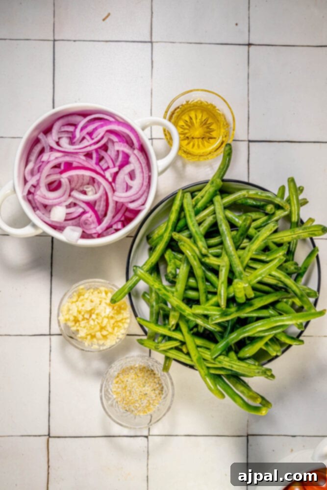 A bowl of sautéed green beans and red onion on a tiled floor.