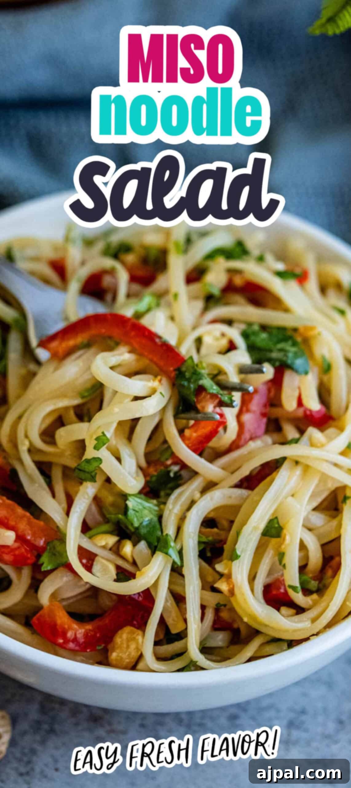 Miso noodle salad served in a white ceramic bowl, showcasing its vibrant ingredients.