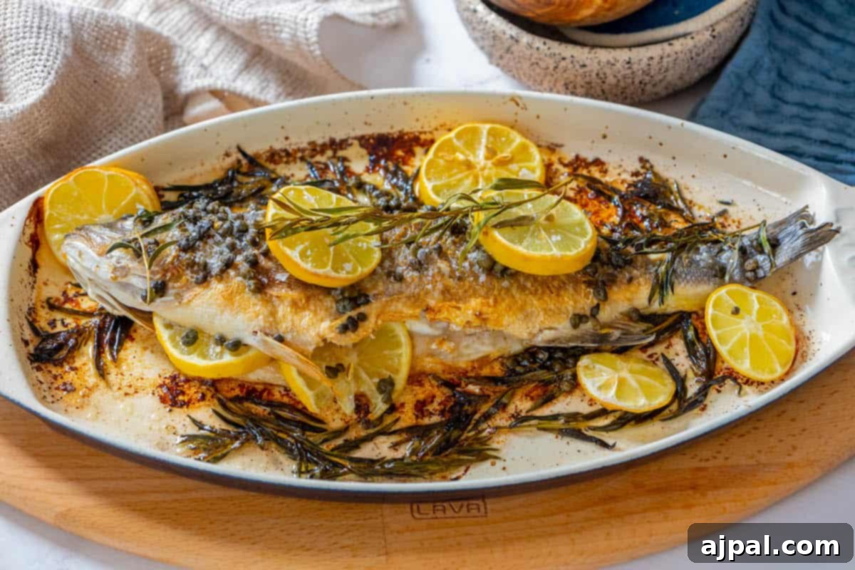 Roasted Branzino with Zesty Lemon-Caper Butter 4 A beautifully roasted Branzino, simply garnished with fragrant lemon slices, capturing the essence of Mediterranean cuisine.