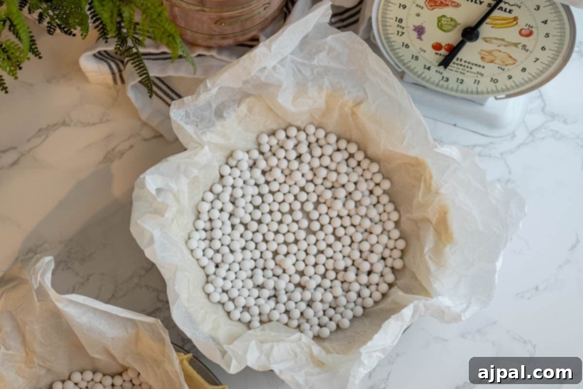 White beans and a measuring scale - the perfect ingredients for an easy pie crust.