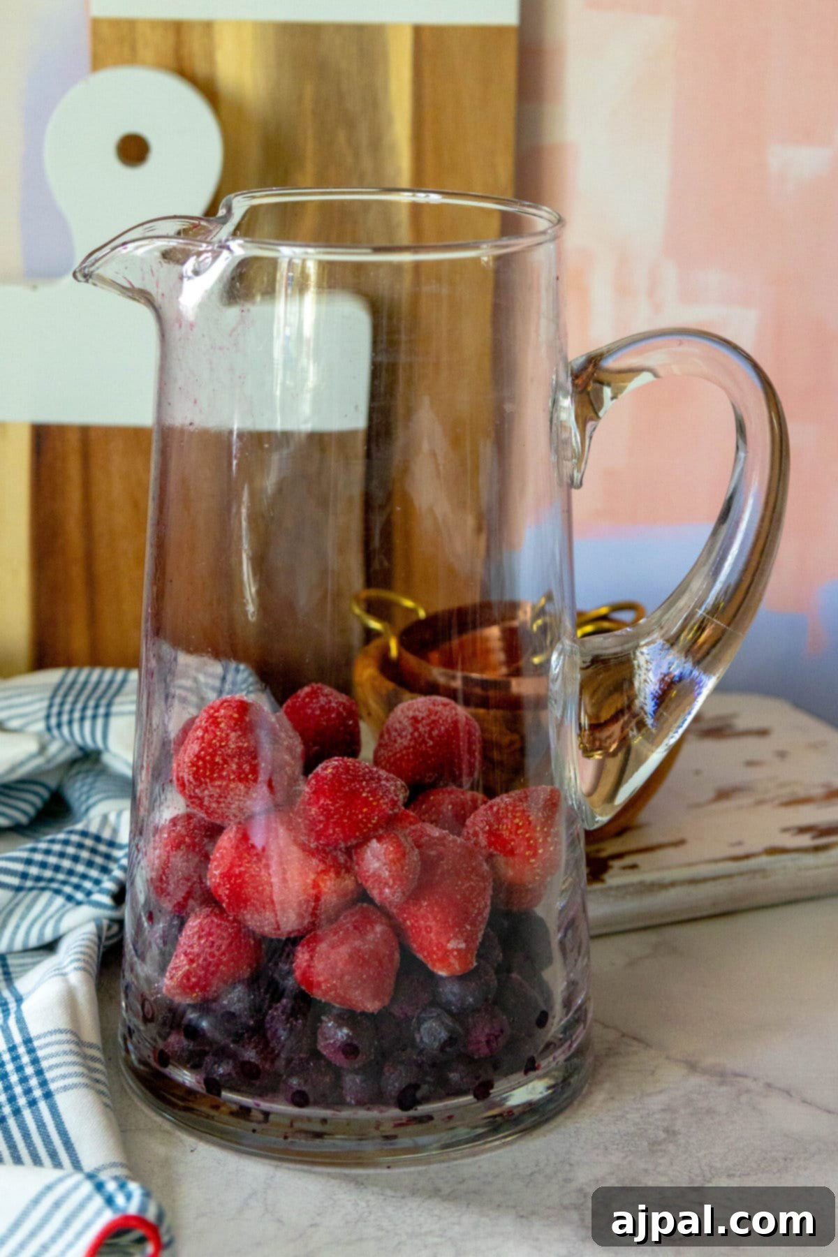 Stars and Stripes Celebration Punch 4 frozen strawberries in a pitcher