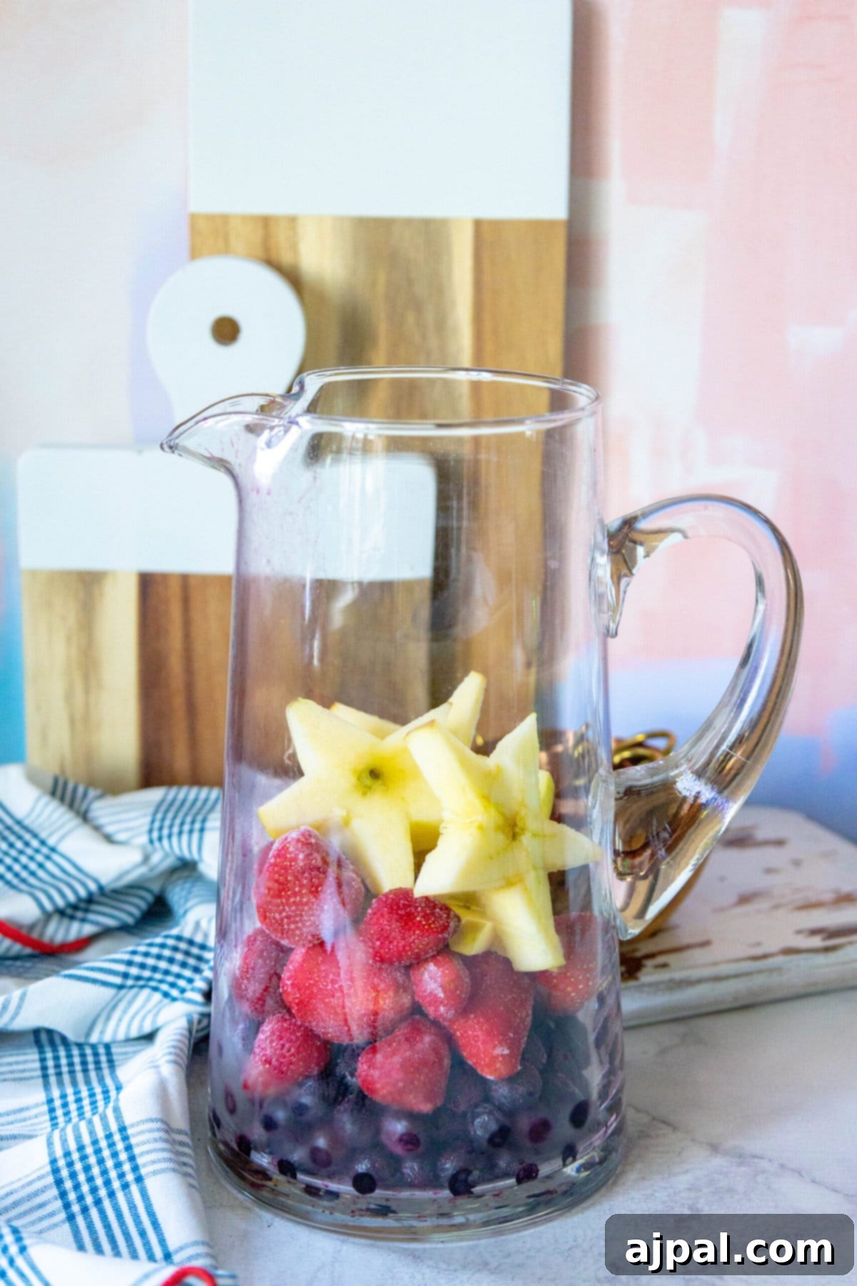 Stars and Stripes Celebration Punch 5 apple slices cut into star shapes in a pitcher