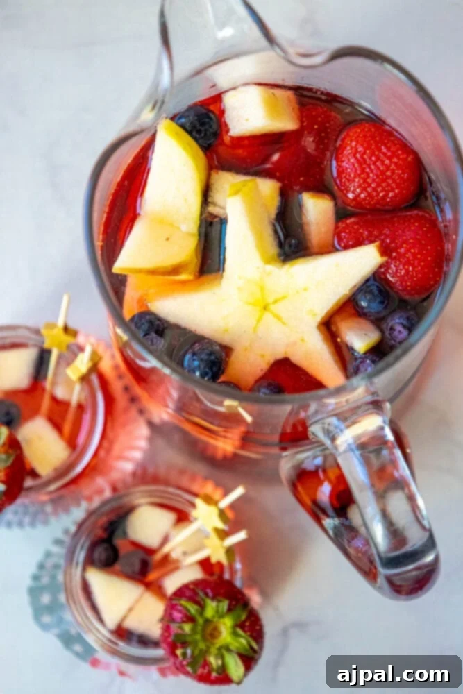Stars and Stripes Celebration Punch 9 A pitcher of fruity Patriotic Punch with star shaped straws.