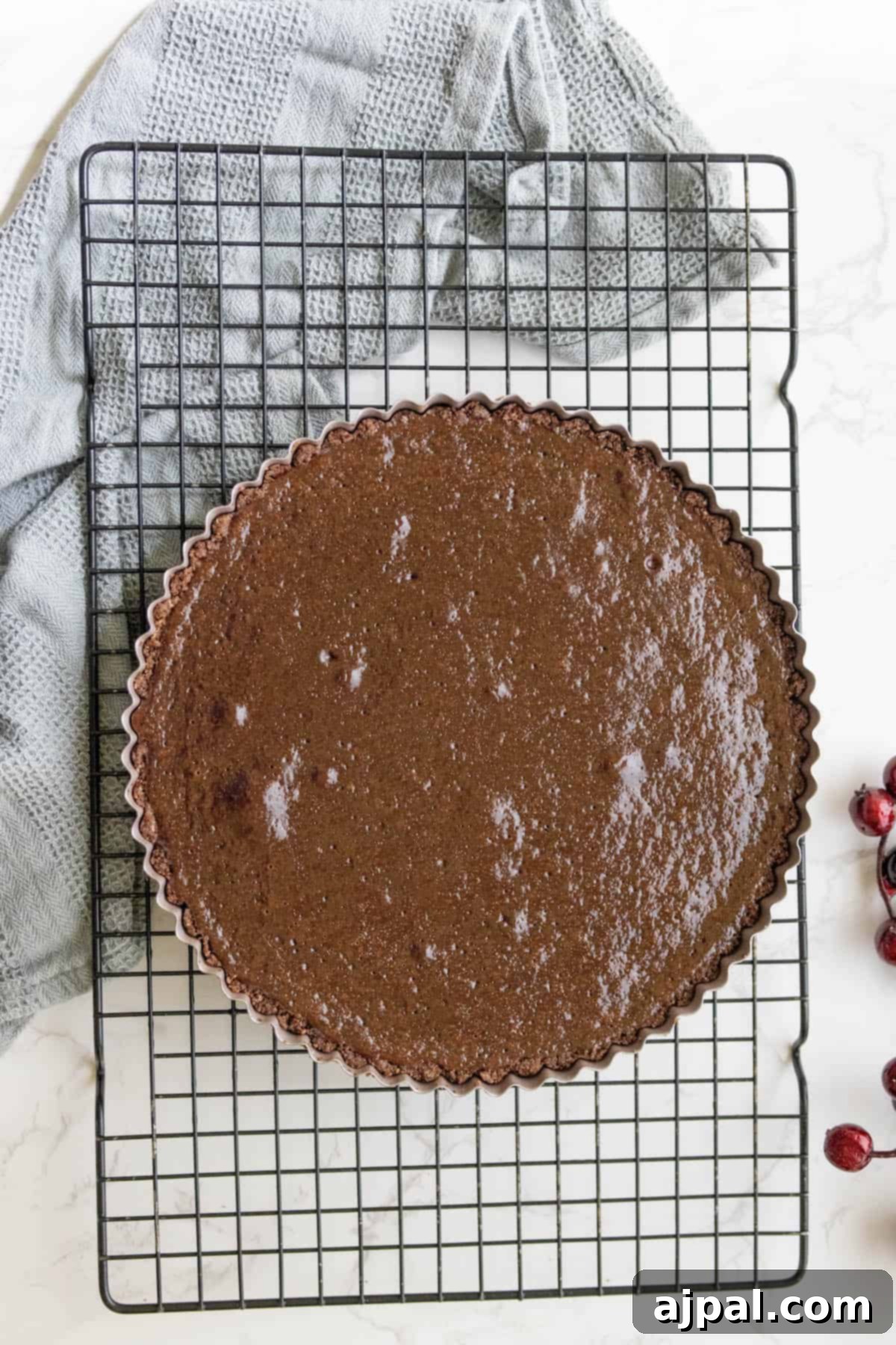 The silky chocolate tart filling poured into the baked graham cracker crust, ready for its final bake.