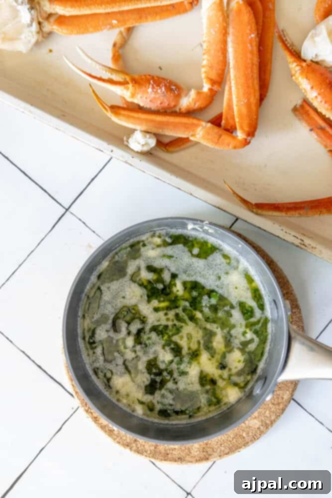 Crabs in a bowl with a sauce on top, baked with snow crab legs.