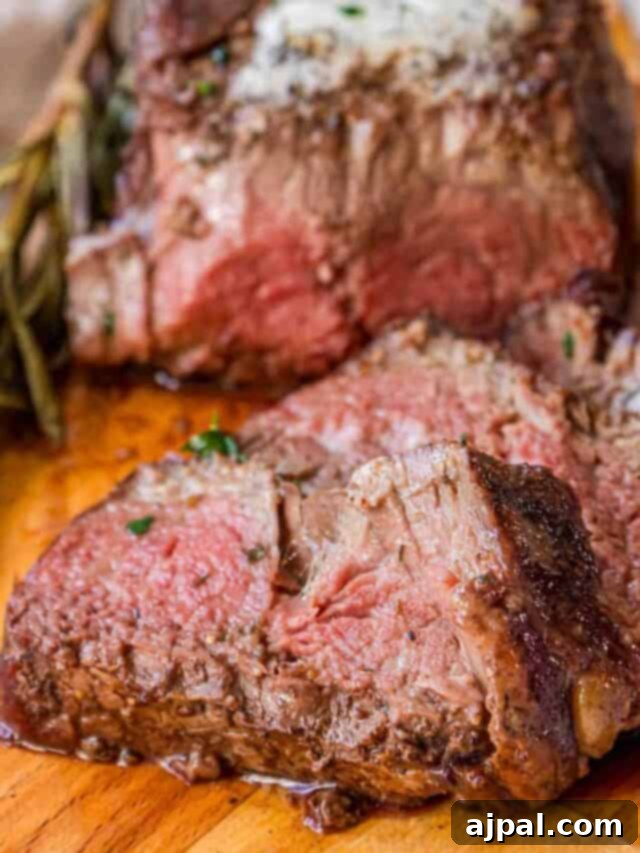 Perfectly Reverse Seared Filet Mignon 11 Steak on a wooden cutting board.