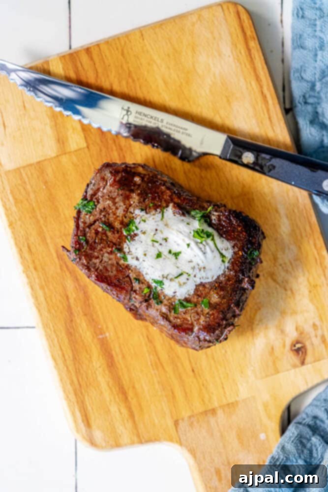 Perfectly Reverse Seared Filet Mignon 3 A Reverse Sear Filet Mignon on a cutting board.