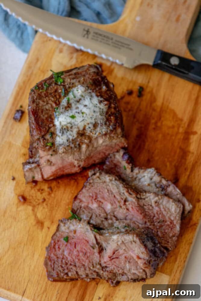 Perfectly Reverse Seared Filet Mignon 4 Reverse seared filet mignon on a cutting board.