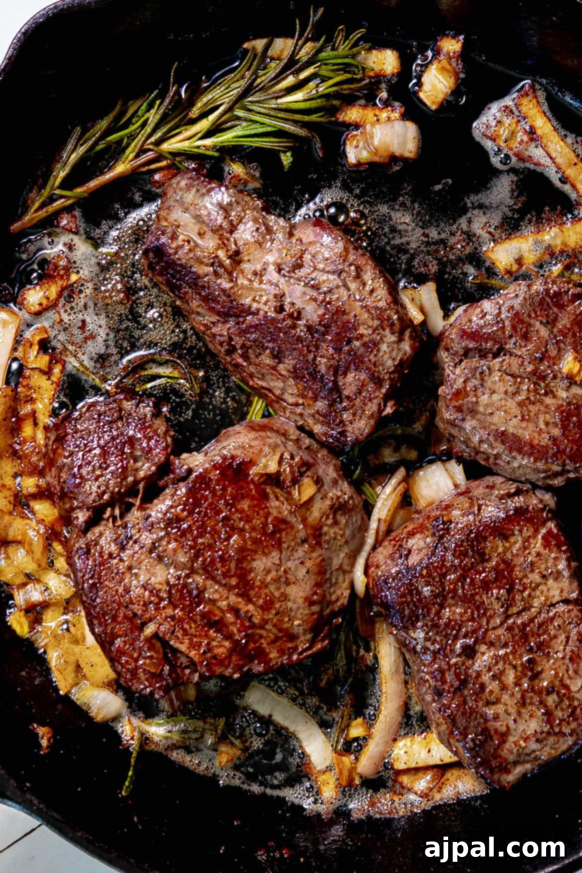 Perfectly Reverse Seared Filet Mignon 9 A reverse sear filet mignon cooked in a cast iron skillet.