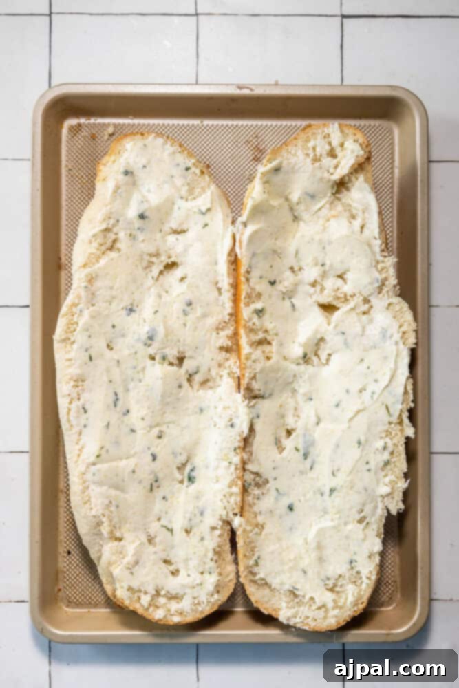 Easy garlic bread with buttered bread slices on a baking sheet.