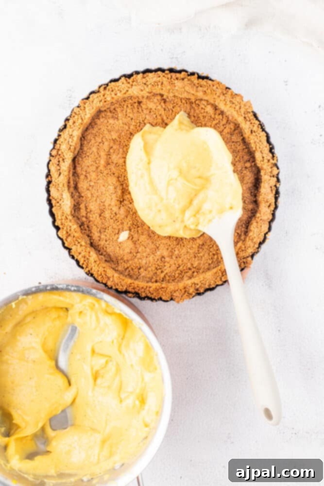 Festive Eggnog Tart 12 A spoon placed in the center of an Eggnog Tart.