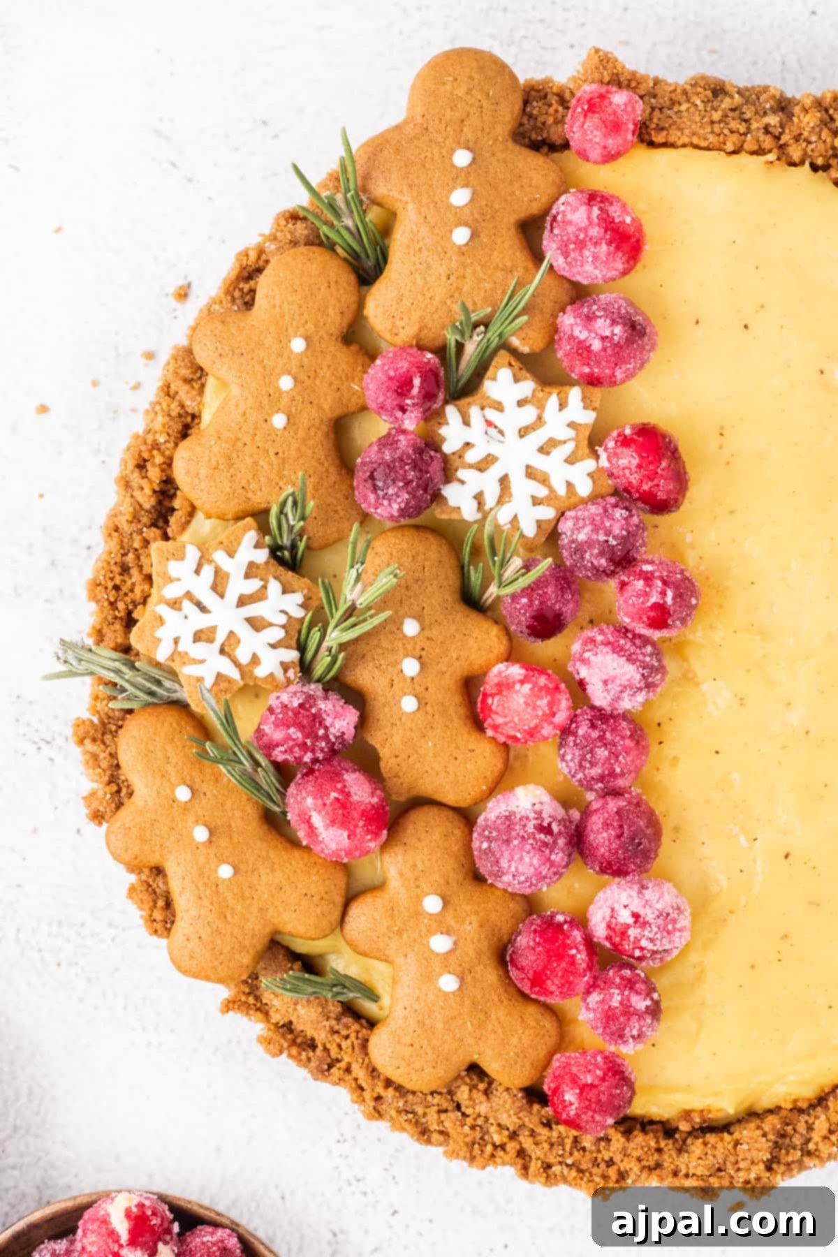 Festive Eggnog Tart 17 Gingerbread pie with cranberries and gingerbread cookies.