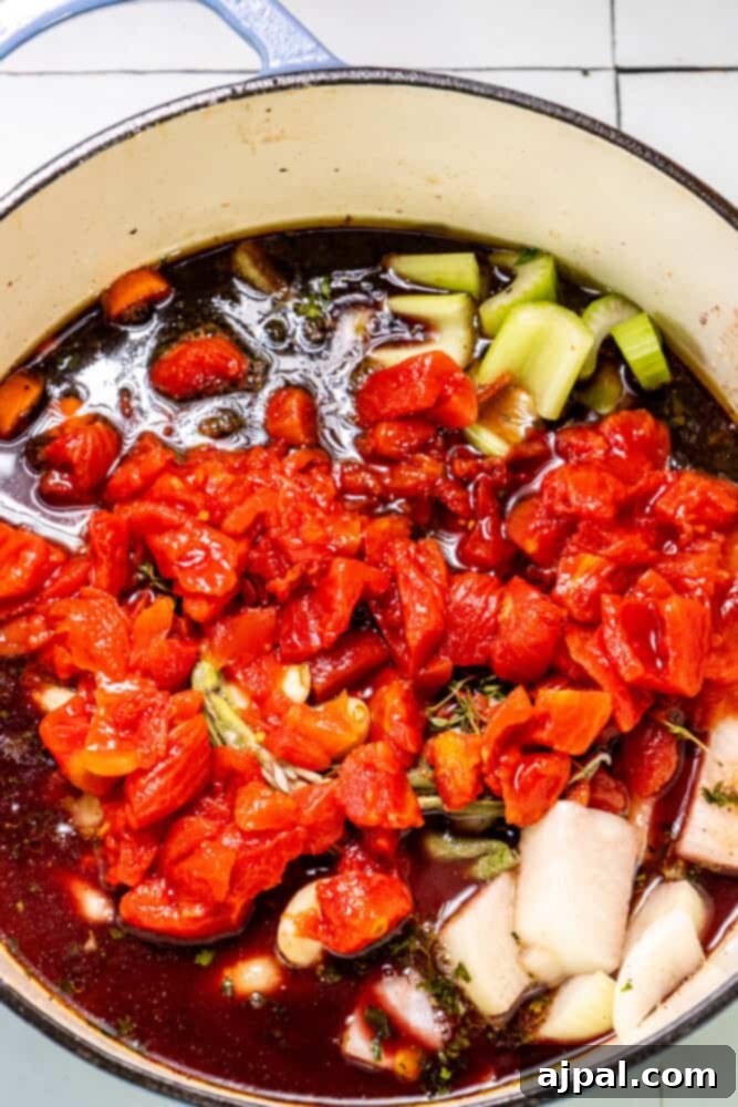 A delicious stew with vegetables and a perfect chuck roast, simmering beautifully.
