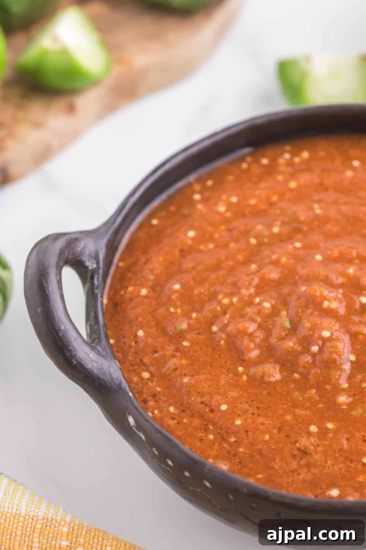 Smoky Chipotle Blaze 4 A close-up shot of a bowl filled with freshly prepared Copycat Chipotle Red Salsa, showcasing its rich texture and vibrant red color.