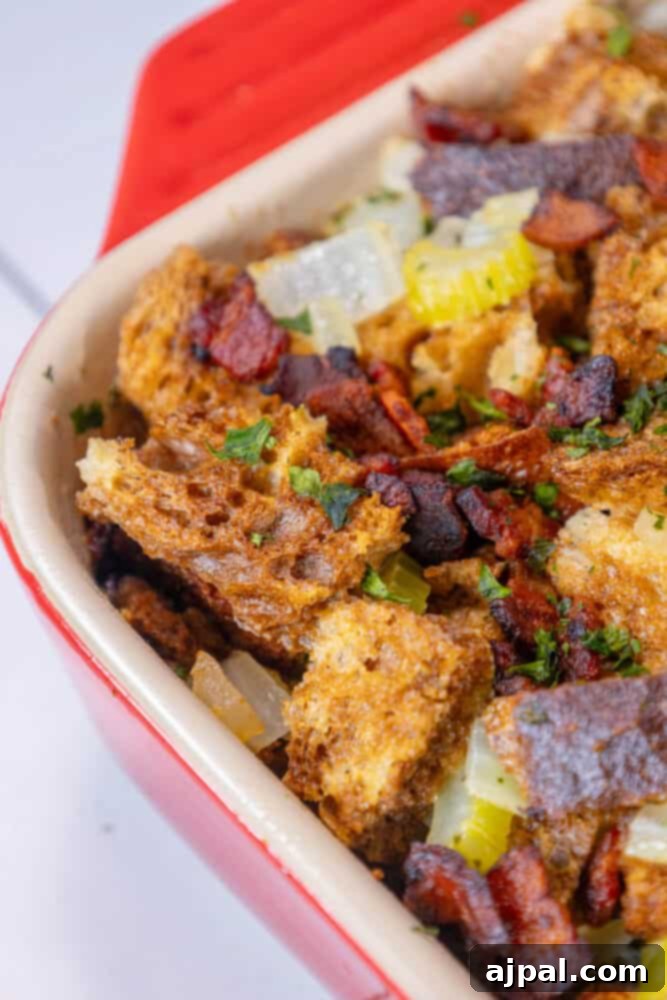 Hearty Bacon Rye Stuffing 4 Bacon and rye stuffing in a red baking dish.
