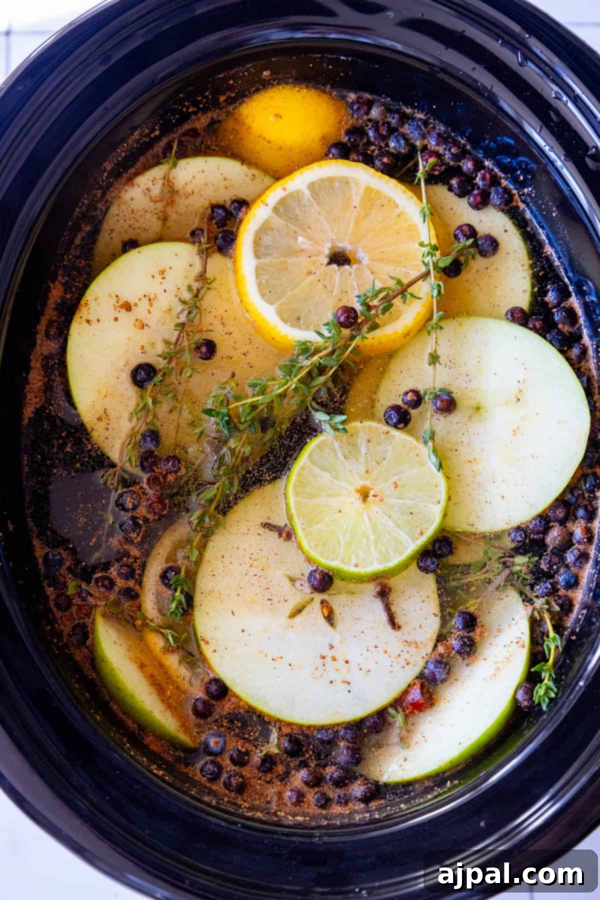 Slow Cooker Christmas Potpourri 3 A crockpot filled with holiday potpourri.