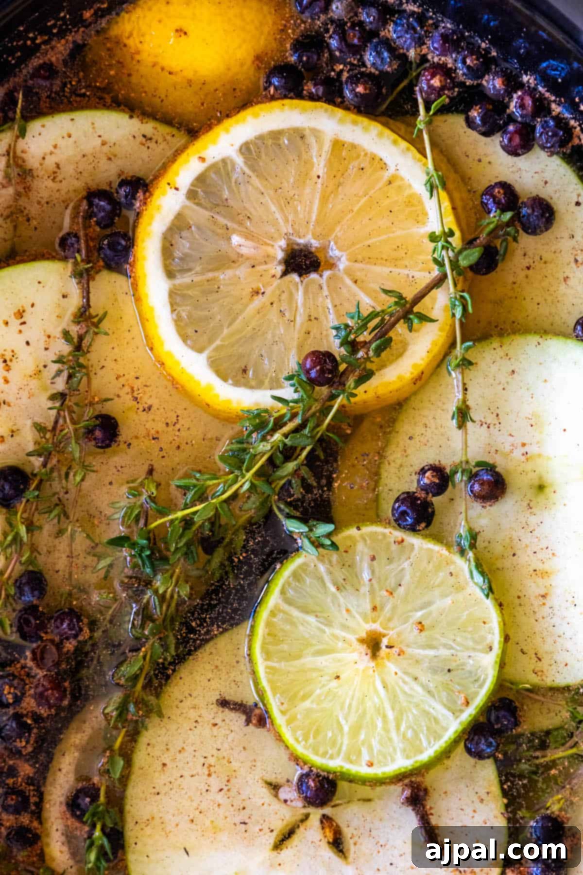 Slow Cooker Christmas Potpourri 6 A crockpot filled with apples, pears, lemons and sprigs of thyme.