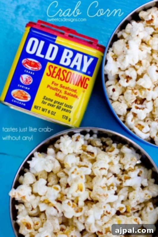 A close-up of a bowl filled with golden Old Bay seasoned popcorn, showcasing the rich seasoning blend on the kernels.