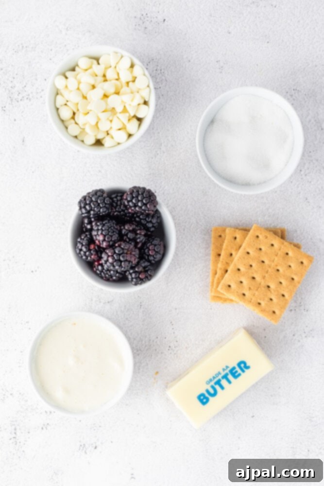 Silken White Chocolate Blackberry Tart 5 A bowl of white chocolate blackberry tart, crackers, butter, berries and cream.