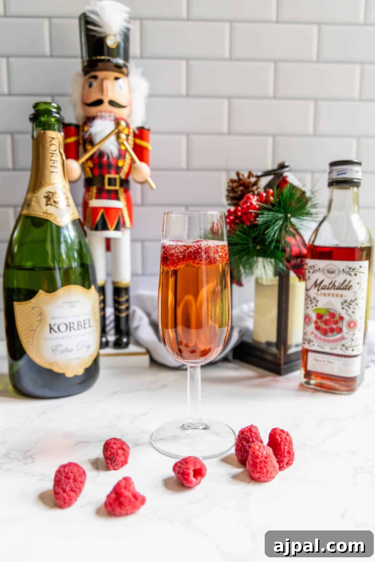 Raspberry Champagne Glow 7 A vibrant raspberry champagne sparkler, beautifully garnished with fresh raspberries and set beside a charming nutcracker, evoking a festive and joyous ambiance.