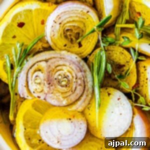 Glistening lemon slices infused with shallots in a bowl, showcasing the rich texture of the confit.