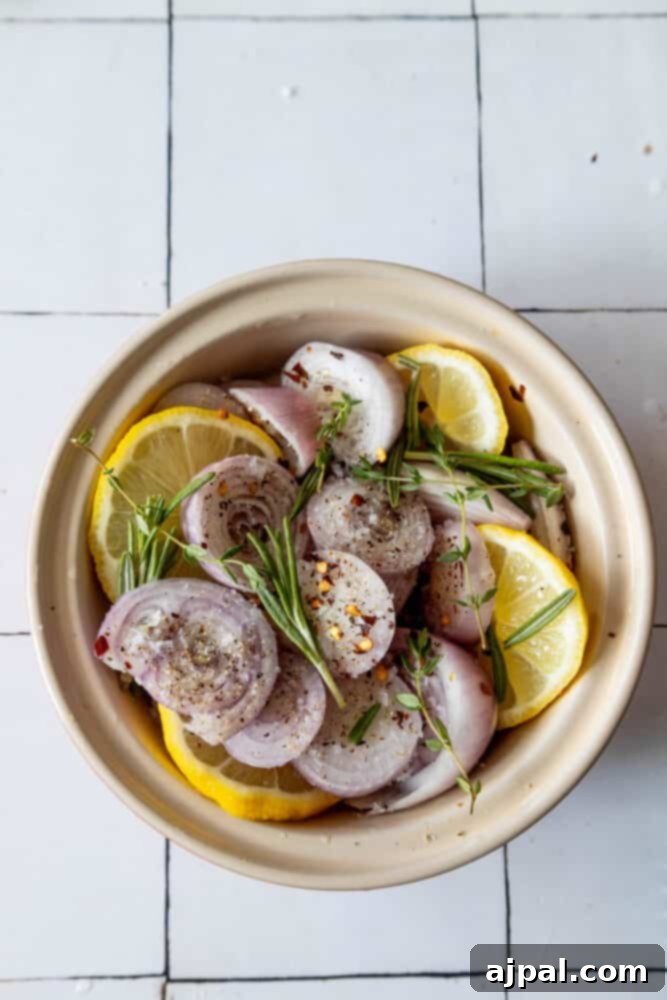 A minimalist bowl featuring vibrant, thinly sliced lemon rounds, arranged artfully on a light-colored tiled surface, ready for culinary use.