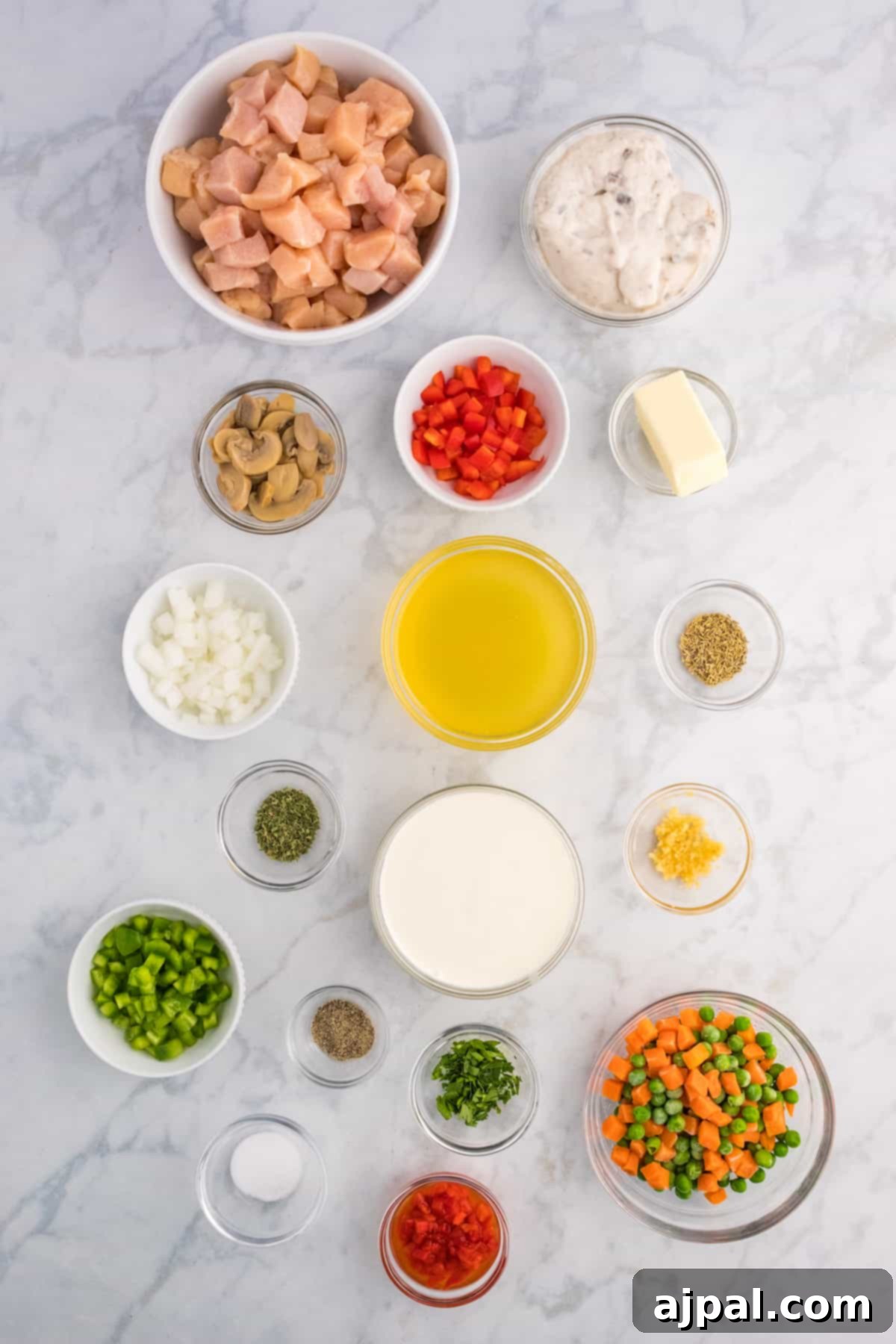 Easy Slow Cooker Chicken a la King 5 The ingredients for a Slow Cooker Chicken Salad on a marble table.