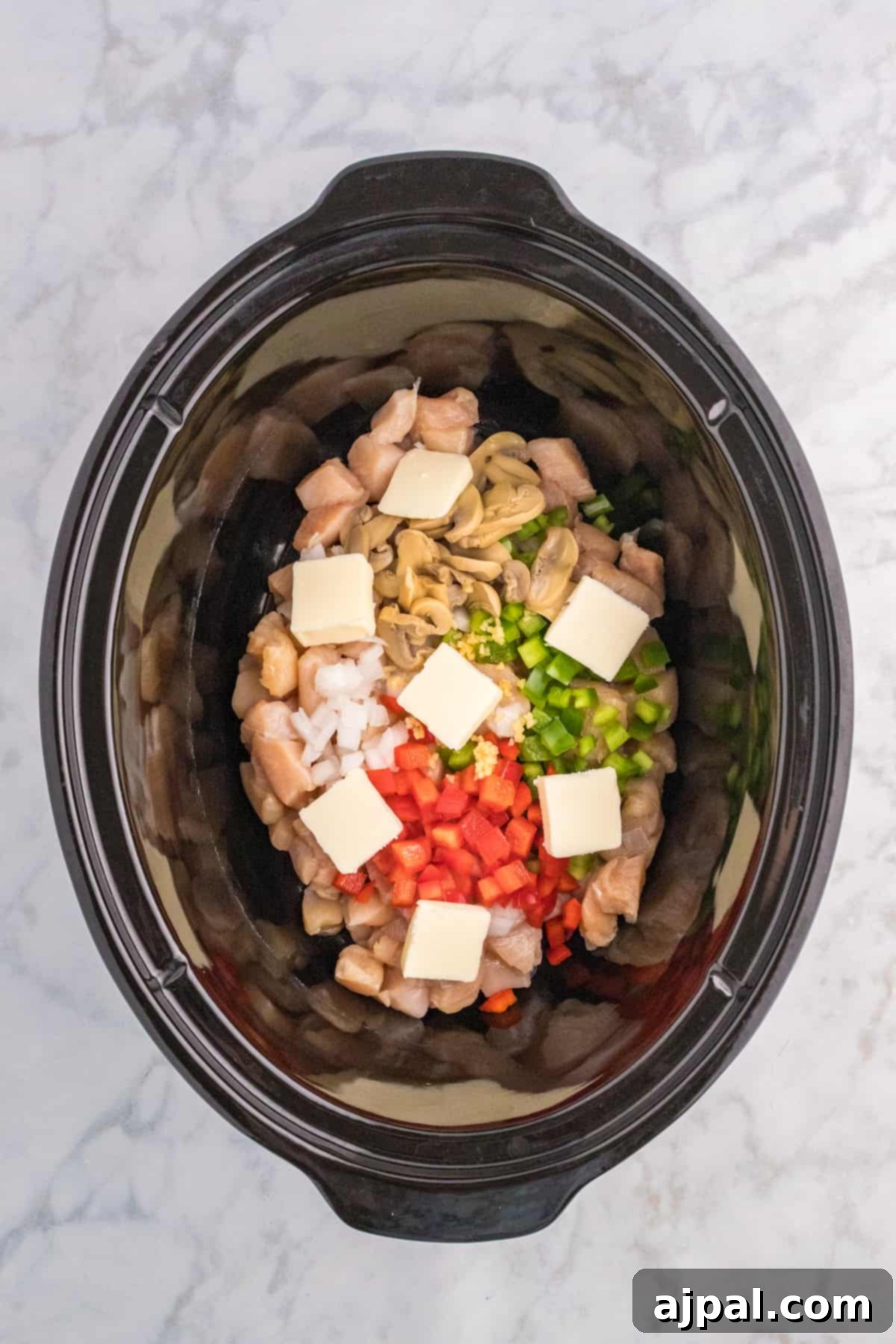 Easy Slow Cooker Chicken a la King 6 A Slow Cooker filled with vegetables and chicken a la King.