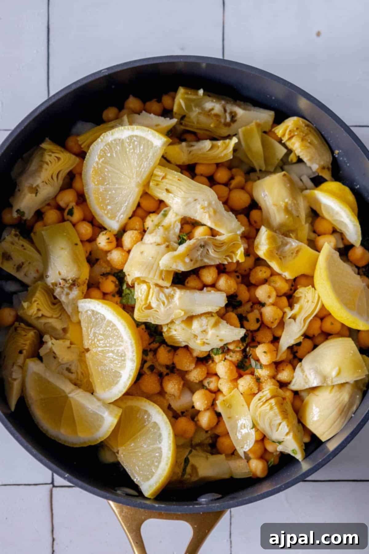 Roasted chickpeas with a hint of lemon cooked in a skillet.