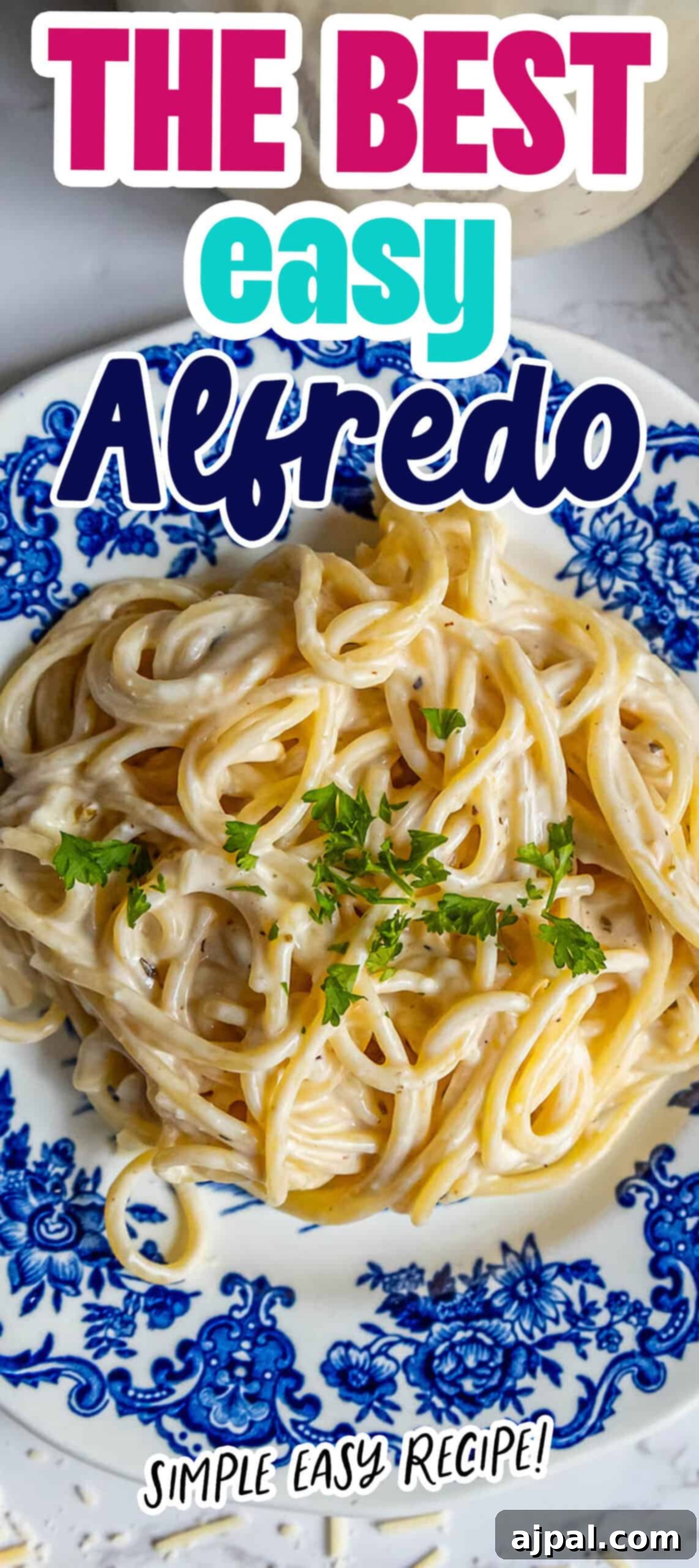 Perfect Homemade Alfredo Sauce 13 A stunning vertical image showcasing a bowl of perfectly cooked pasta coated in the best easy Alfredo sauce, garnished with fresh herbs and a generous sprinkle of Parmesan cheese.