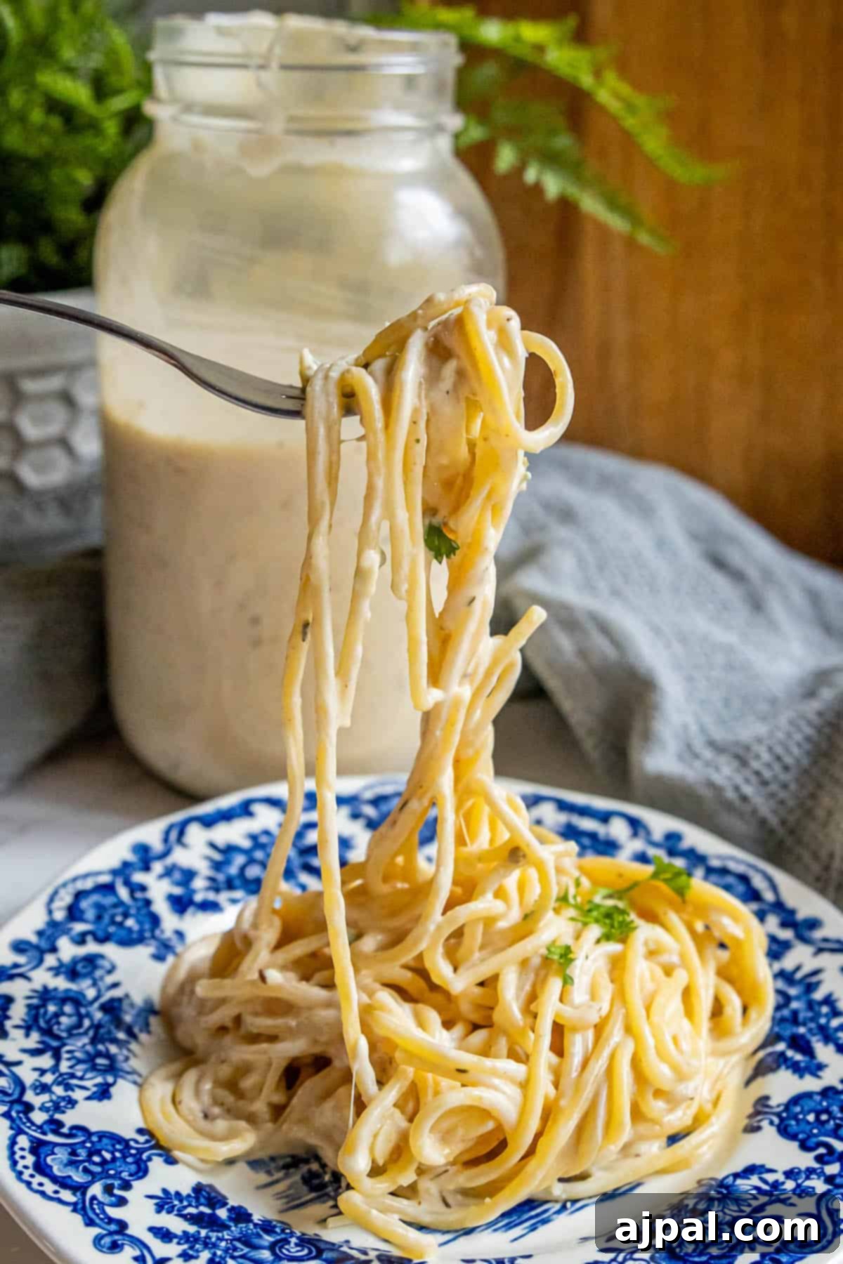 Perfect Homemade Alfredo Sauce 4 A tantalizing plate of pasta adorned with the best homemade Alfredo sauce, promising a rich and creamy culinary delight.