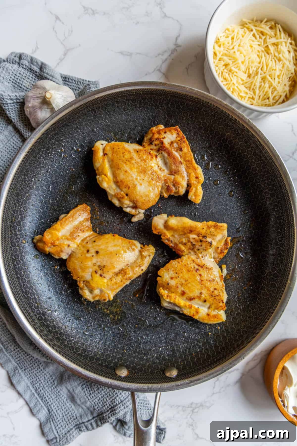 Creamy Chicken Alfredo Perfection 7 Fried chicken in a frying pan.