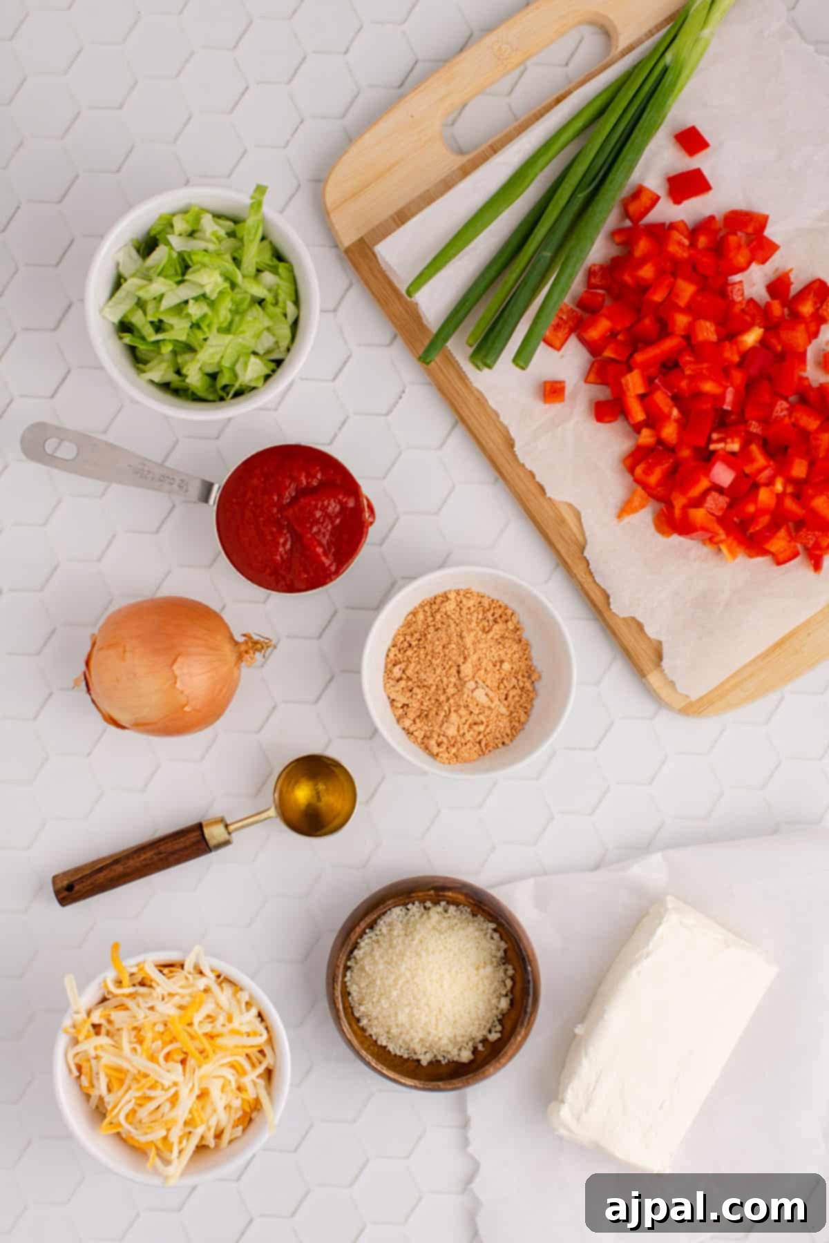 Zesty Taco Dip 5 Hot, cheesy taco dip served with tortilla chips on a white table.