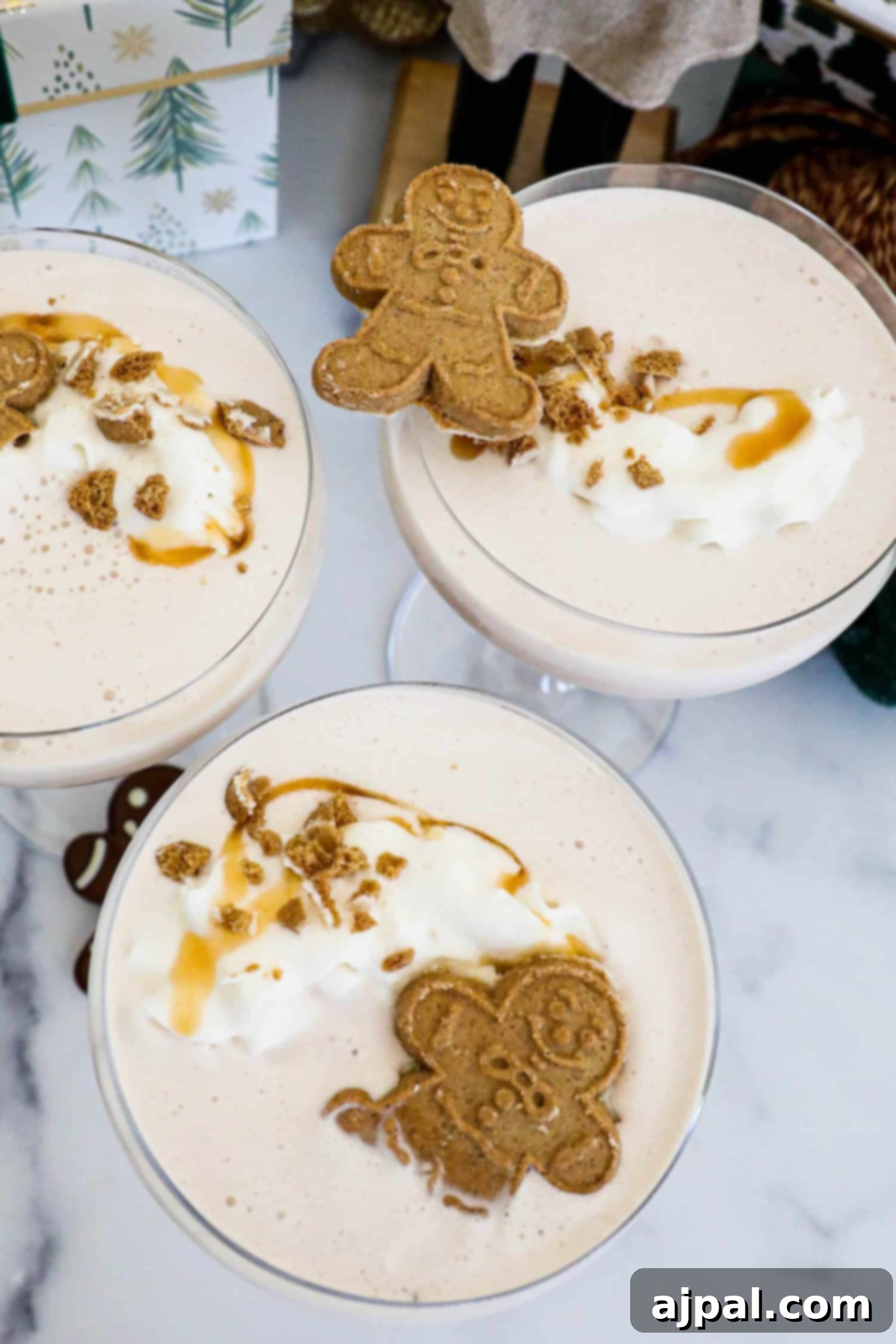 Gingerbread Spice Martini 2 Three glasses of gingerbread iced tea with whipped cream and gingerbread cookies, garnished with a Gingerbread Martini.